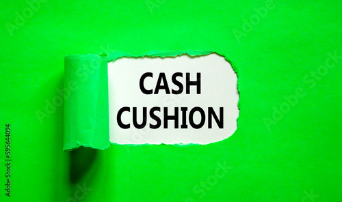 Cash cushion symbol. Concept words Cash cushion on beautiful white paper. Beautiful green table green background. Business and Cash cushion concept. Copy space.