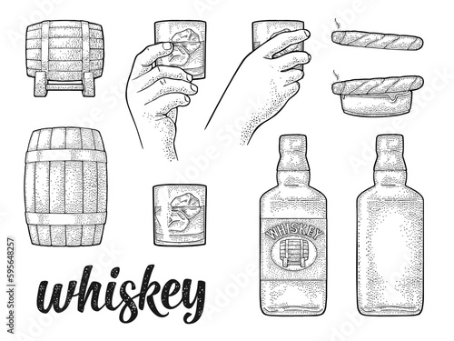 Whiskey glass with ice cubes, barrel, bottle and cigar.