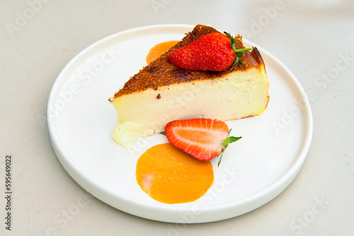 San sebastian ( Bask ) cheesecake slice isolated close up. Limon, lotus, fistikli, Frambuazli cheesecake
