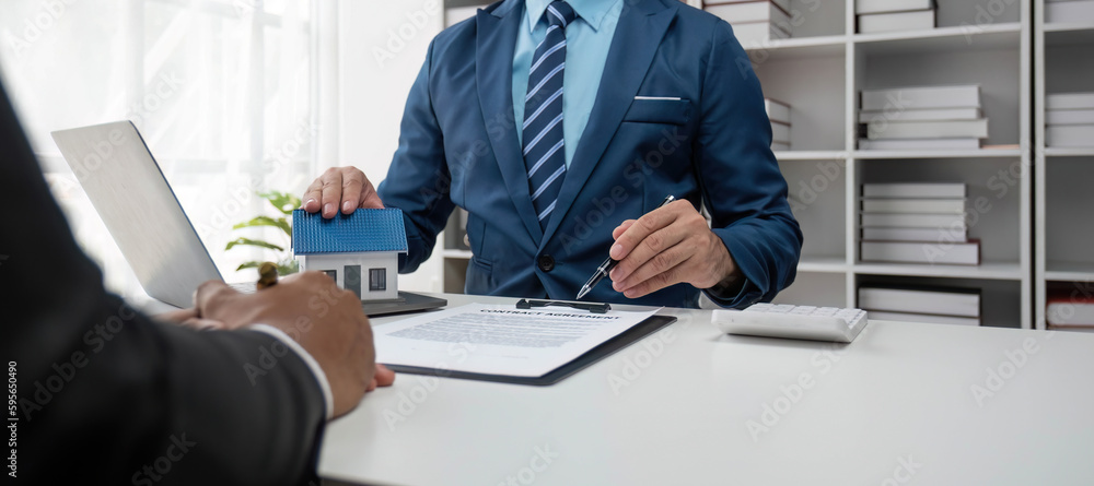 House model with agent and customer discussing for contract to buy, get insurance or loan real estate or property... House model with agent and customer discussing for contract to buy, get insurance or loan real estate or property...