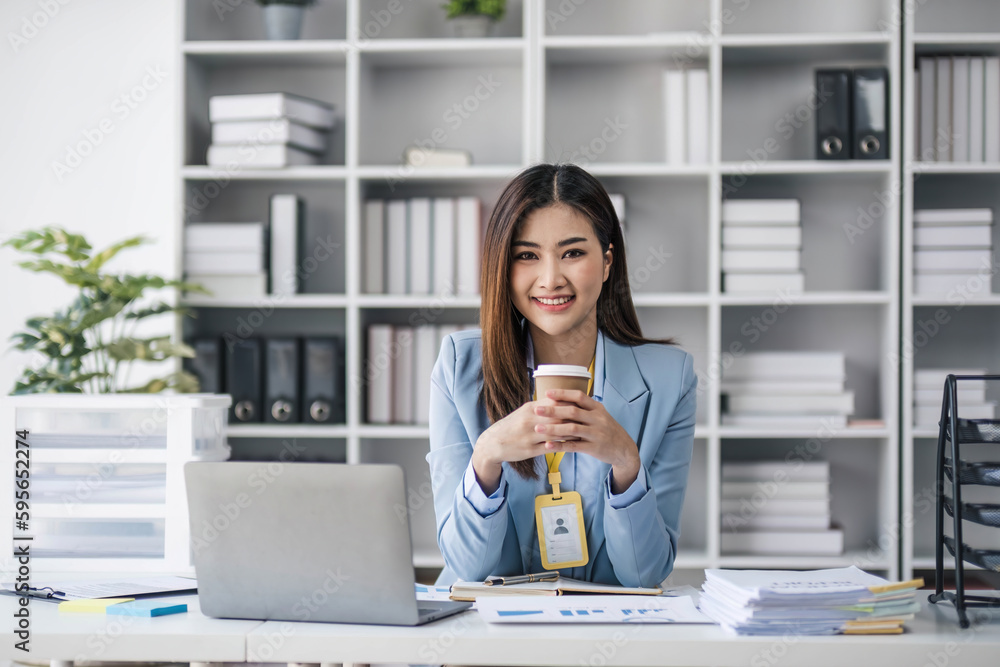 Business woman using calculator for do math finance on wooden desk in office and business working background, tax, accounting, statistics and analytic research concept.. Business woman using calculator for do math finance on wooden desk in office and business working background, tax, accounting, statistics and analytic research concept..