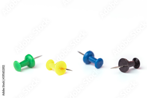 Push pins on white background