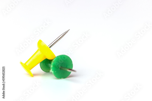 Push pins on white background