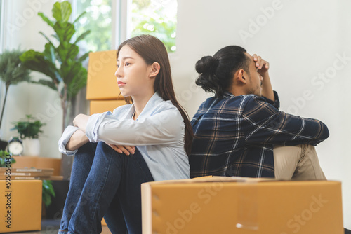 Stressed business due to outbreak of coronavirus, asian young couple moving new relocation unemployed, loss job. Debt, mortgage, loan. Unhappy fights relationship trouble, expression of disappointment