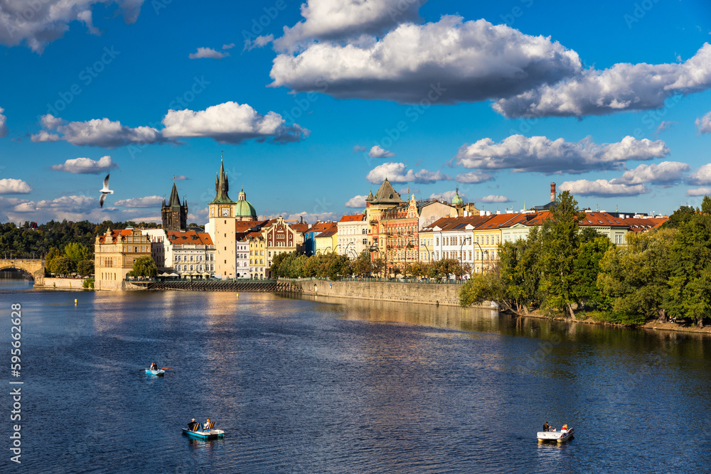 Scenic embankment in Prague city; Historical center of Prague, buildings and landmarks of old town, Prague, Czech Republic. Embankment of the Vltava river in Prague, the capital of Czechia.