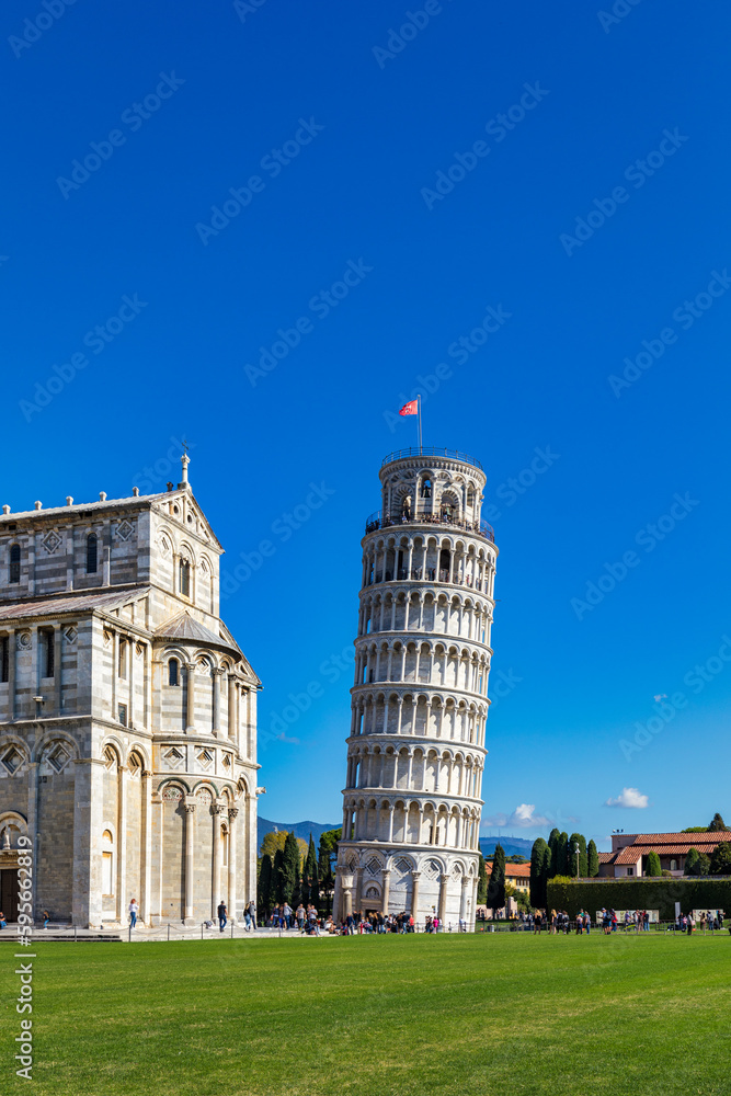 Leaning Tower of Pisa in a sunny day in Pisa, Italy. Leaning Tower of Pisa on Piazza dei Miracoli in Pisa, Tuscany, Italy.