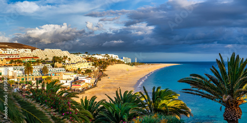 Morro Jable, Fuerteventura, Spain. Breathtaking beach Playa del Matorral in the rays of the sunset. Morro Jable and Playa del Matorral, Fuerteventura, Canary Islands, Spain, Atlantic, Europe