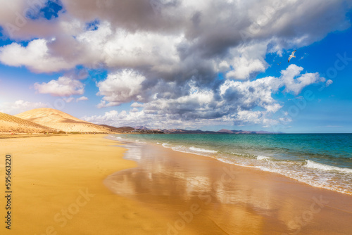 View on the beach Sotavento with golden sand and crystal sea water of amazing colors on Costa Calma on the Canary Island Fuerteventura, Spain. Beach Playa de Sotavento, Canary Island, Fuerteventura.