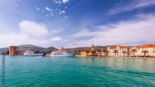 View at town Trogir, old touristic place in Croatia Europe with seagull's flying over city. Trogir town coastal view. Magnificent Trogir, Croatia. Sunny old Venetian town, Dalmatian Coast in Croatia.