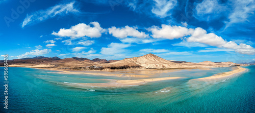 View on the beach Sotavento with golden sand and crystal sea water of amazing colors on Costa Calma on the Canary Island Fuerteventura, Spain. Beach Playa de Sotavento, Canary Island, Fuerteventura. © daliu