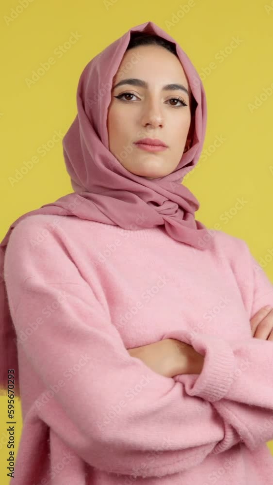 Strong and proud muslim woman standing looking at camera Strong and proud muslim woman standing looking at camera