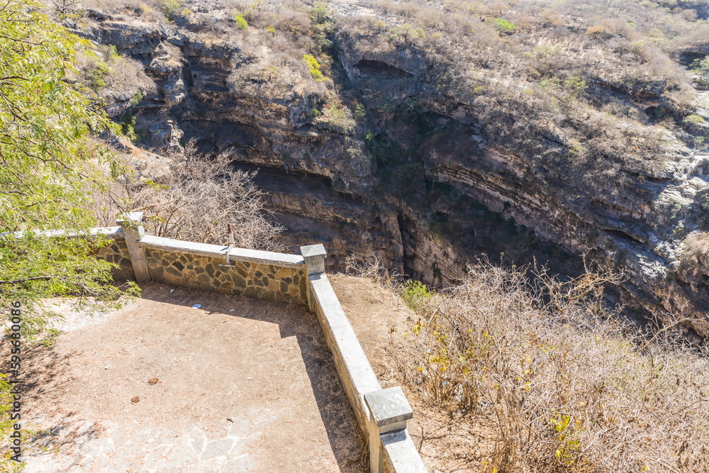 Park near the Tawi Atair Sinkhole Oman, the most famous sinkhole in the Dhofar (Dofar