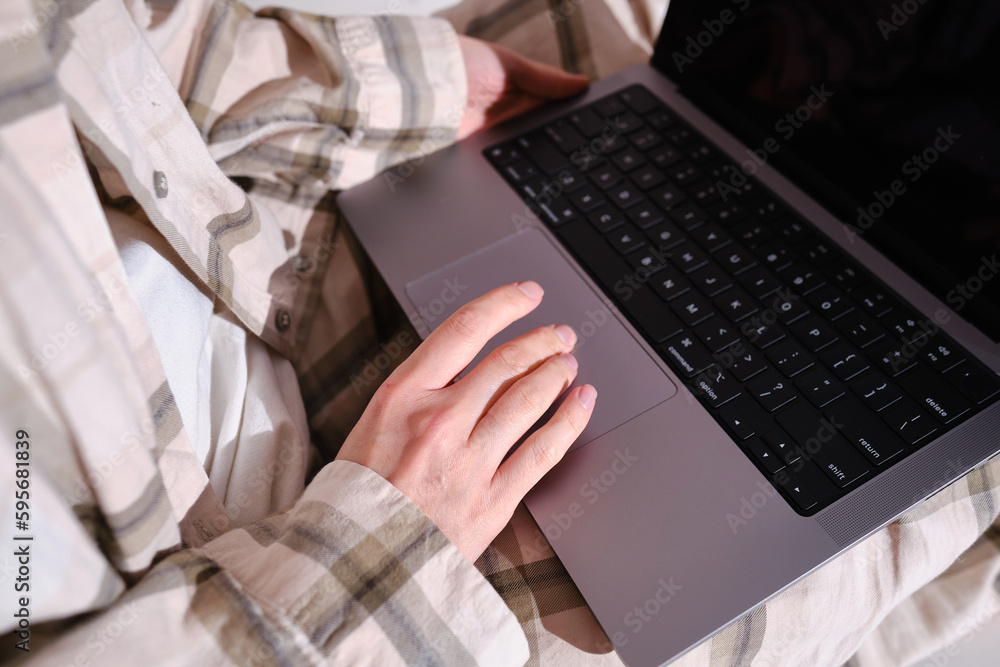 Woman working on laptop at home. Freelance girl. Internet business. Distant work. Modern lifestyle, working day. Lightweight workplace. Mobile device. Type on a keyboard Woman working on laptop at home. Freelance girl. Internet business. Distant work. Modern lifestyle, working day. Lightweight workplace. Mobile device. Type on a keyboard