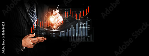Businessman analyst working with digital finance business data graph showing technology of investment strategy for perceptive financial business decision. Digital economic analysis technology concept.