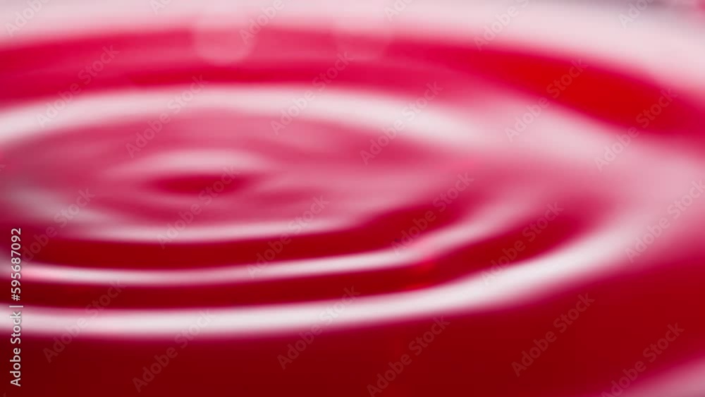 Slowly falling drops of wine. Falling drop of wine in slow motion. Wine drop falling into red wine. Close-up shot Slowly falling drops of wine. Falling drop of wine in slow motion. Wine drop falling into red wine. Close-up shot