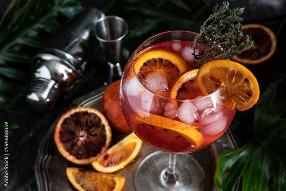 Citrus cocktail with ice and citrus clices, summer cold drink in glass Citrus cocktail with ice and citrus clices, summer cold drink in glass