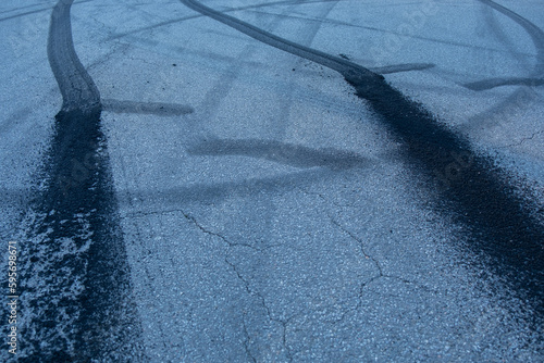 Traces from car tires on the asphalt. Auto sport photo