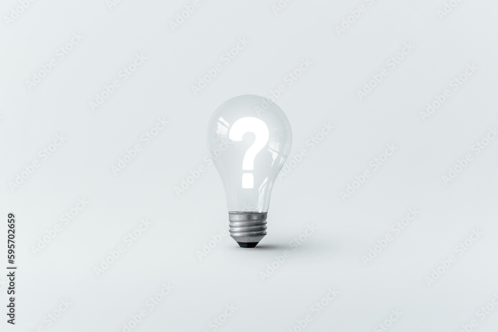 Glowing question mark inside a light bulb. Glowing question mark inside a light bulb.
