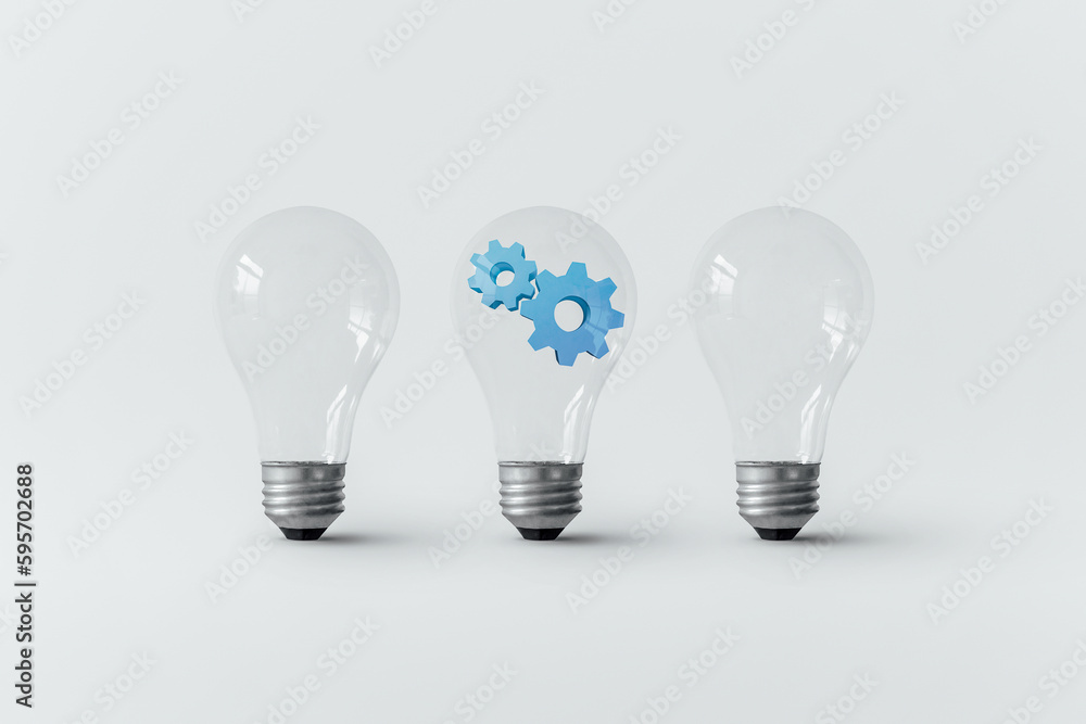 Blue gear inside light bulb. Blue gear inside light bulb.