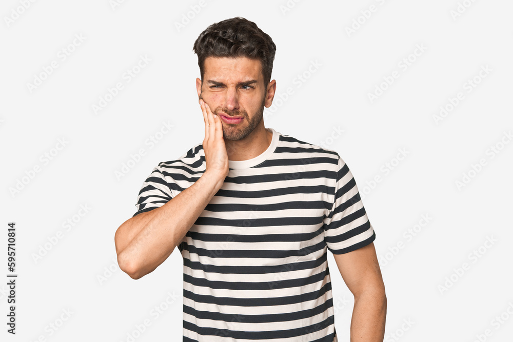 Young handsome man isolated having a strong teeth pain, molar ache. Young handsome man isolated having a strong teeth pain, molar ache.