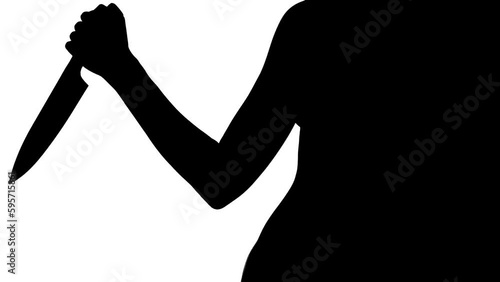 Yound woman silhouette raising and lowering a knife