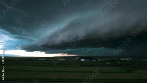 Big Storm Shelf Cloud Drifting Over Farm Land Time Lapse photo
