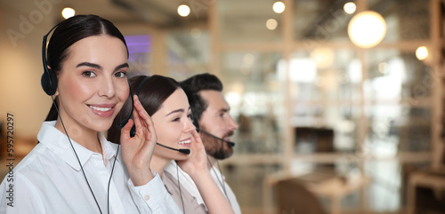 Hotline operators with headsets in office, space for text. Banner design