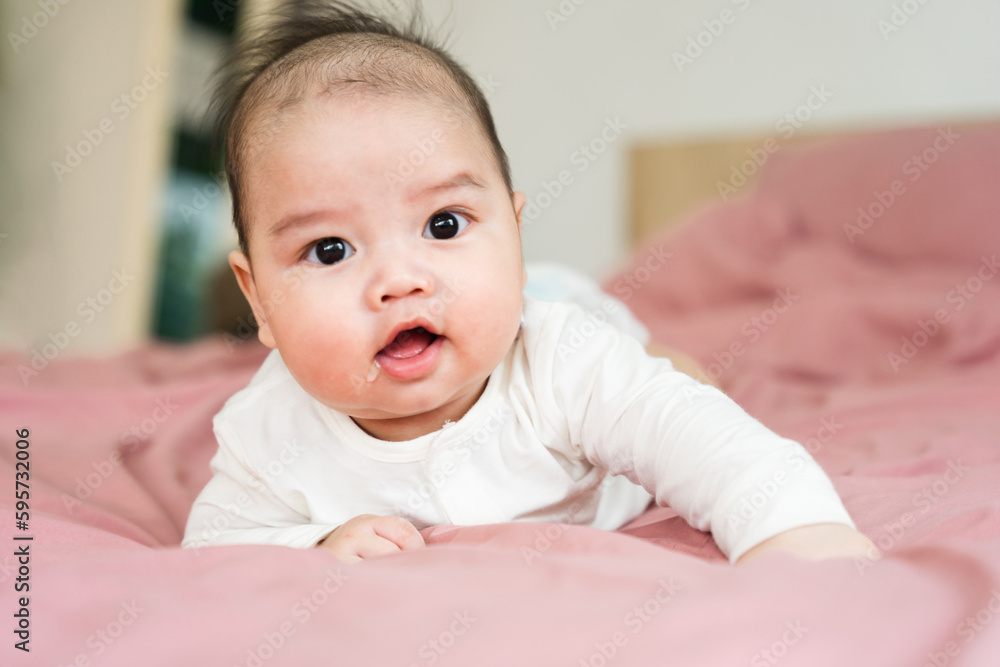 image of a newborn baby lying on a pink bed image of a newborn baby lying on a pink bed