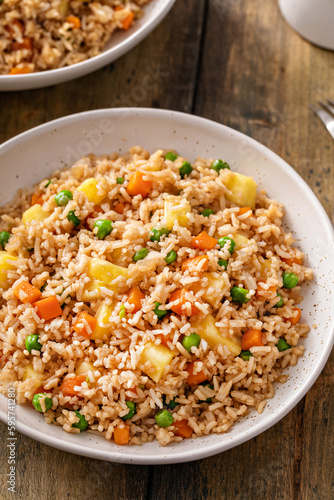 Pineapple fried rice with peas and carrots