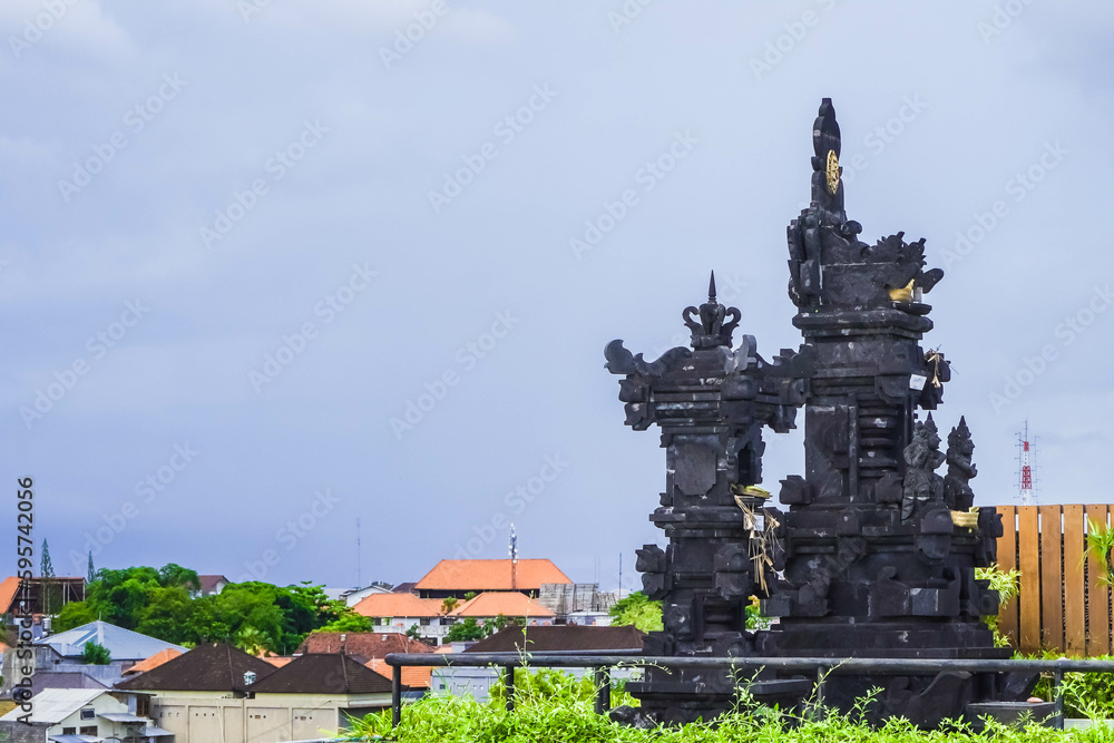 Hindu Temple in Bali, Indonesia. A place to put offerings and pray for Balinese Hindus. Low angle photo with empty blank space for copy and text.