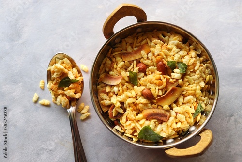 Thick Pohe Chiwda. Diwali special savory snack, made out of puffed rice, fried peanuts, curry leaves and some spices. Traditional Indian Diwali Snacks. with Copy Space. photo