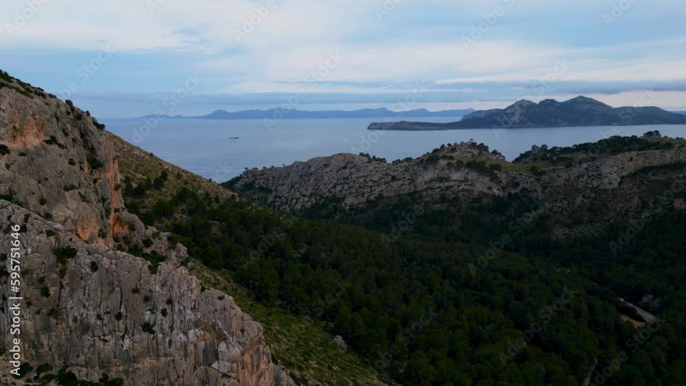 Palma de Mallorca, Cap de Formentor massive mountain rock. Green vibrant hills, blue seaside sea sky horizon. Scenic Majorca Island mountain ridge peak nature aerial drone footage. Cinematic 4K UHD. Palma de Mallorca, Cap de Formentor massive mountain rock. Green vibrant hills, blue seaside sea sky horizon. Scenic Majorca Island mountain ridge peak nature aerial drone footage. Cinematic 4K UHD.