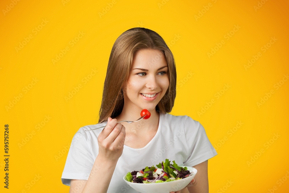 Healthy Meal concept. Happy Woman hold Vegetable Salad Healthy Meal concept. Happy Woman hold Vegetable Salad