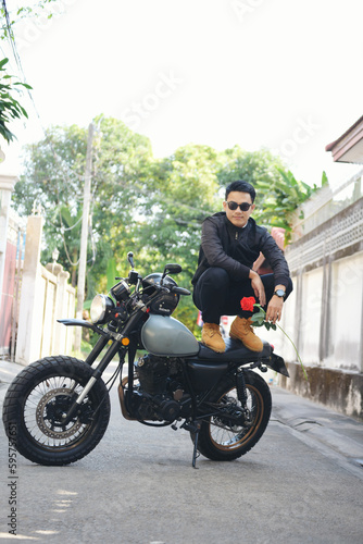 Asian man motorbike in black leather jacket travel rider trip. Handsome Men wear sunglass outdoor lifestyle freedom rider. Men trendy hipster cool person. Young asian man hobby ride with motor bike