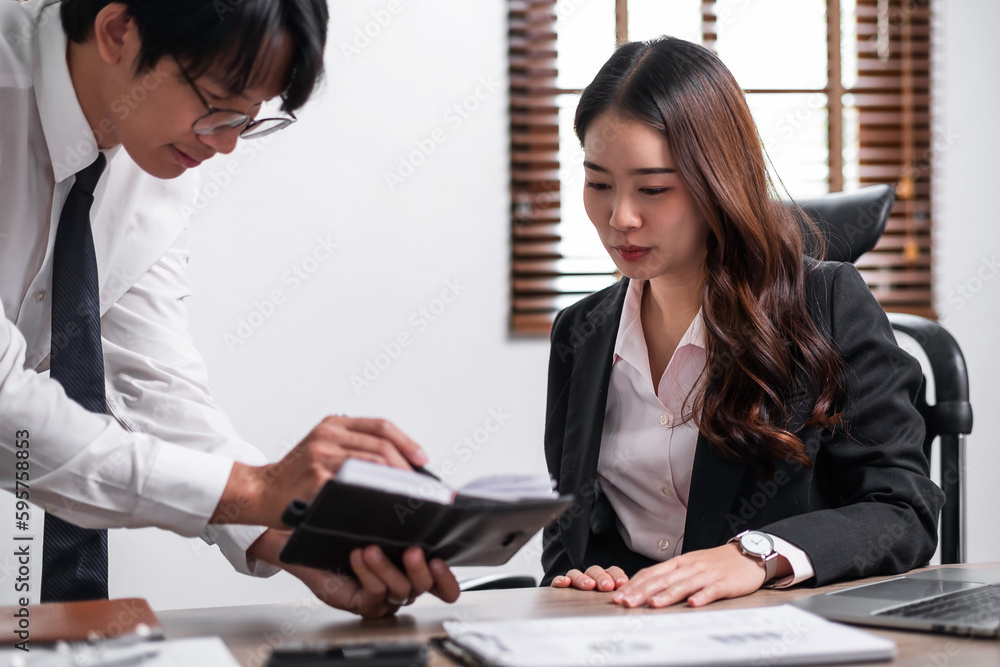 Young confident business people sitting at the office table working with partner. Business concept Young confident business people sitting at the office table working with partner. Business concept