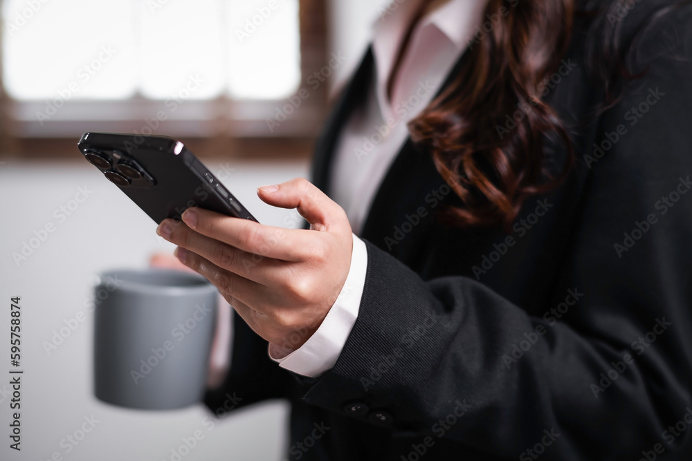 Close up of young asian confident businesswoman hand using smart phone mobile at office table working Close up of young asian confident businesswoman hand using smart phone mobile at office table working
