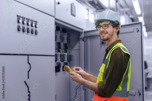 An engineer inspects the equipment and machinery for any signs of wear and tear and ensures that they are adequately maintained. photo