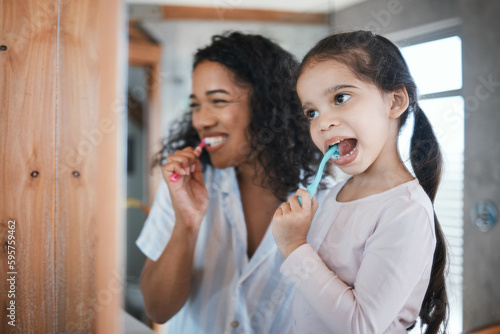 Brushing teeth  child and mom with dental cleaning and learning in a bathroom. Mother  kid and smile of wellbeing and wellness with happiness of health care and toothbrush in the morning at home