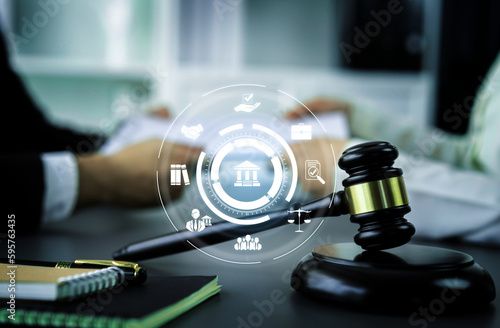 Smart law, legal advice icons and lawyer working tools in the lawyers office showing concept of digital law and online technology of astute law and regulations . photo