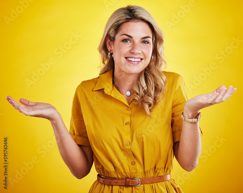 Portrait, shrug and woman with a smile, confused and decision with lady against studio background. Face, female model and person with happiness, doubt and unsure with choices, hand gesture and emoji photo