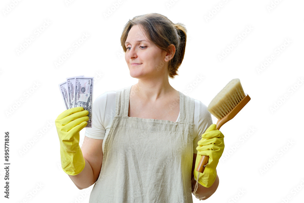 A woman holds money in dollars while cleaning a home kitchen, isolated on a white background A woman holds money in dollars while cleaning a home kitchen, isolated on a white background