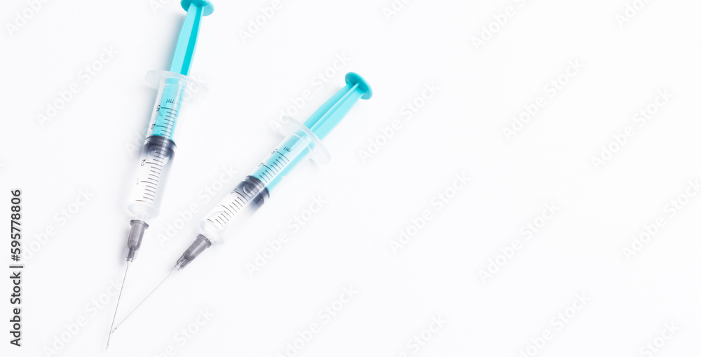 Disposable plastic syringe prepared for injection and vaccination in the hospital. The concept of medicine and health Disposable plastic syringe prepared for injection and vaccination in the hospital. The concept of medicine and health