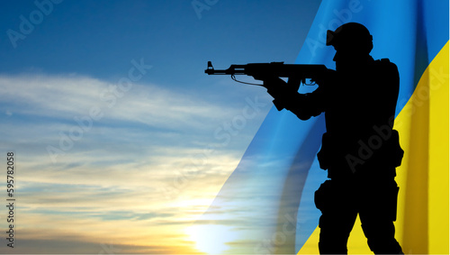 Flag of Ukraine with silhouette of soldier against the sunset. EPS10 vector