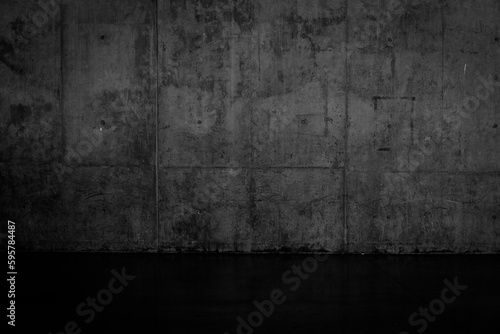 Grungy dark concrete wall and wet floor © romantsubin