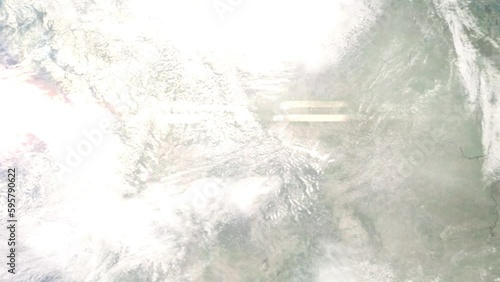 Earth zoom in from outer space to city. Zooming on Kalispell, Montana, USA. The animation continues by zoom out through clouds and atmosphere into space. Images from NASA photo