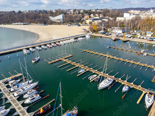 Obraz na płótnie Aerial view landscape Poland Gdynia. Port with sailing boats , marina, view of beach and sea. Photo from a drone. w salonie