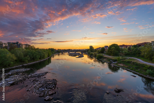 Nice view of bridge over Ticino river in Pavia at sunset, Lombardy, italy.
