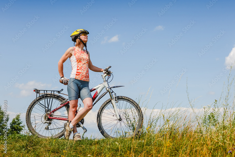 girl on a bicycle relaxing on sunny meadow girl on a bicycle relaxing on sunny meadow