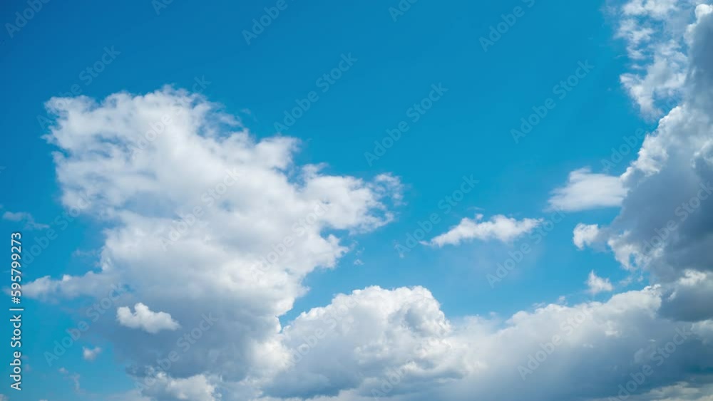 Blue sky with white cumulus clouds. The clear sky is clouded by rainy dark clouds. Summer timelapse. Blue sky with white cumulus clouds. The clear sky is clouded by rainy dark clouds. Summer timelapse.