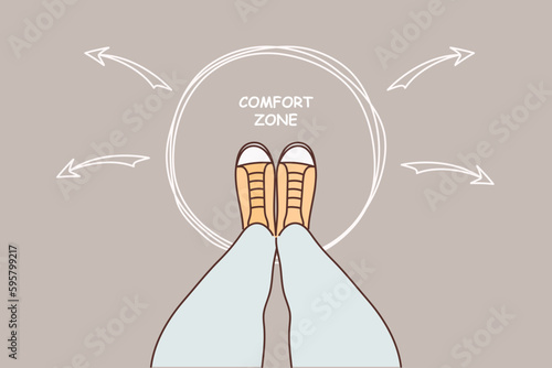 Human legs and inscription comfort zone on pavement for concept of self-improvement